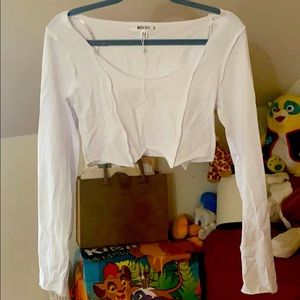 White raw edges long sleeve top .